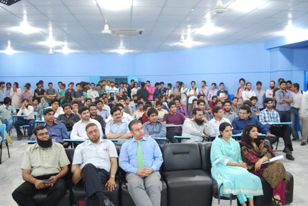 UMT faculty members and students listen to the success story of Ali Malik